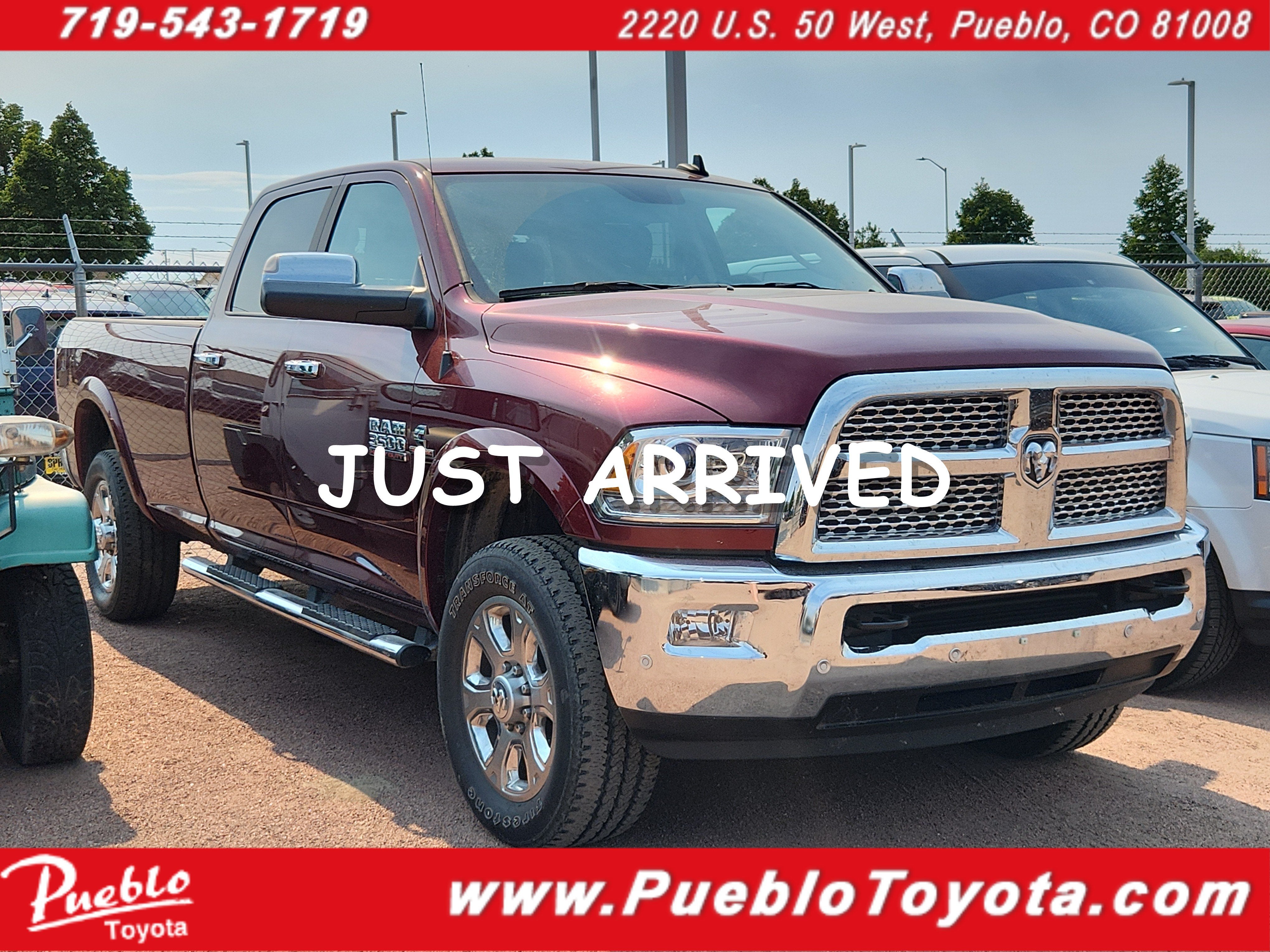 2016 RAM 3500 Laramie in Delmonico Red Pearlcoat — front three-quarter view