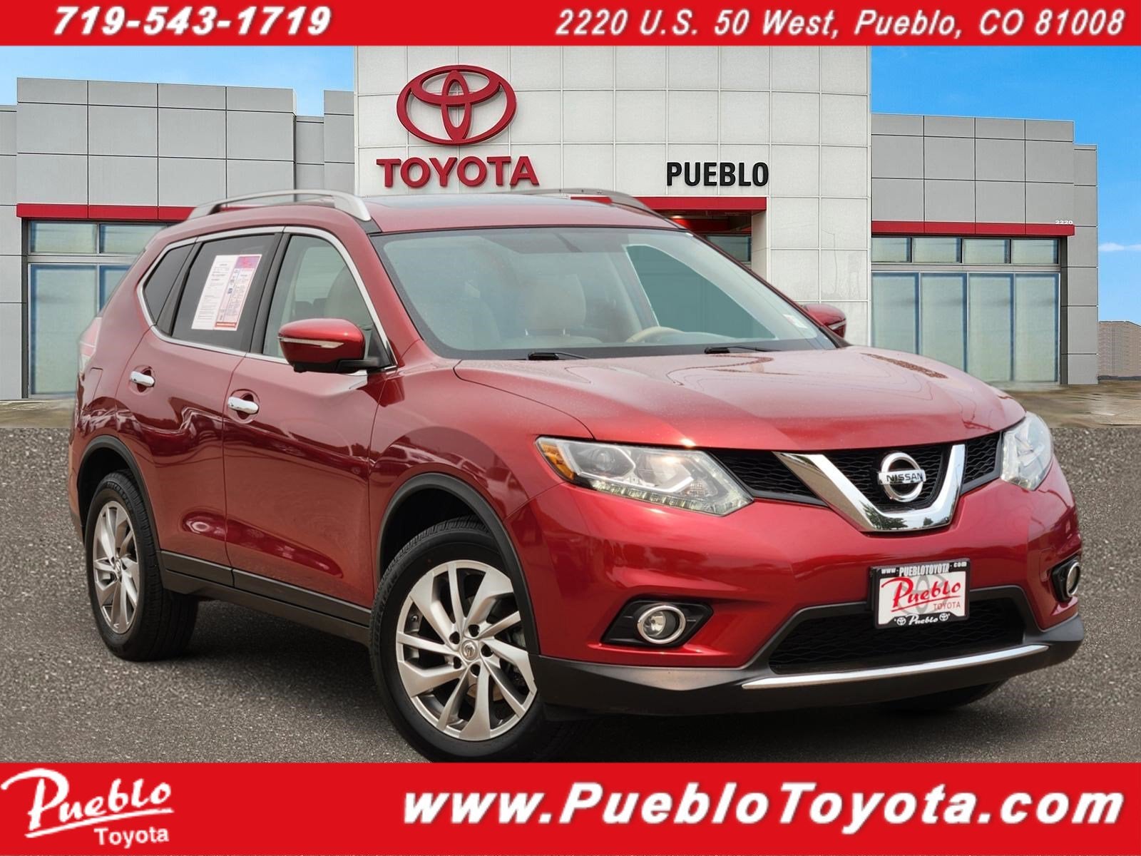 2015 Nissan Rogue SL in Cayenne Red — front three-quarter view