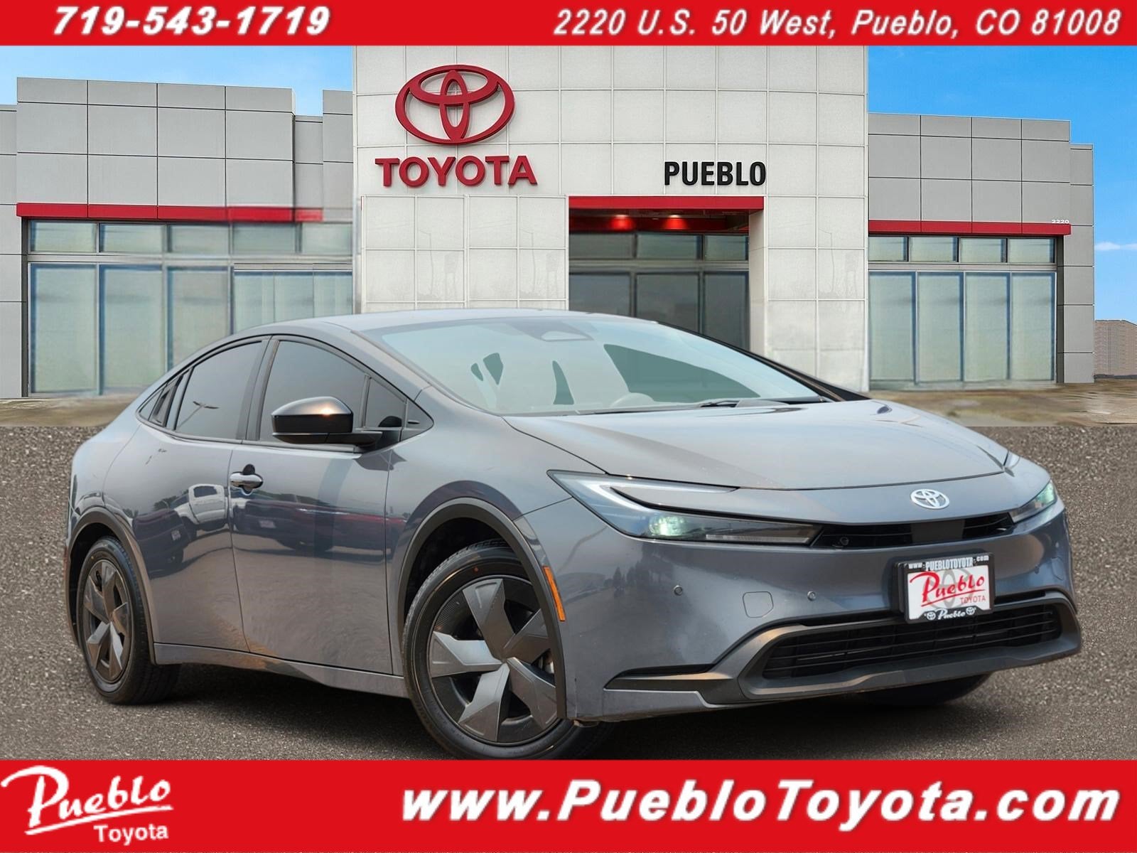 2024 Toyota Prius LE in Guardian Gray — front three-quarter view